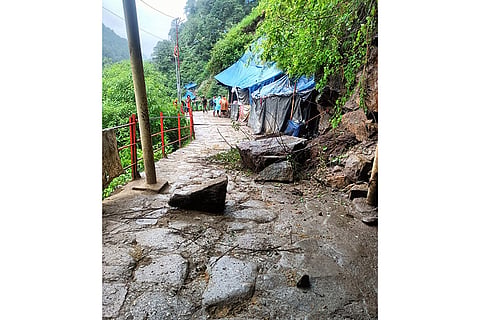 Debris lies on a road after landslide